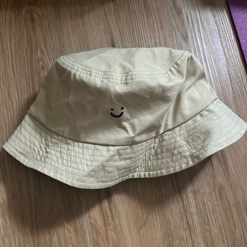 Tan smiley face bucket hat